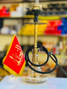 ست قلیان اسکای بدنه استیل طلایی براق شیشه عسلی دارای شلنگ و سری سیلیکونی ست قلیان اسکای بدنه استیل طلایی براق شیشه عسلی کد SK107